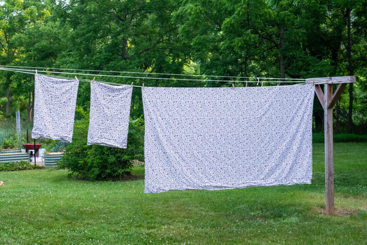 Percale cotton sheets hanging on a clothesline