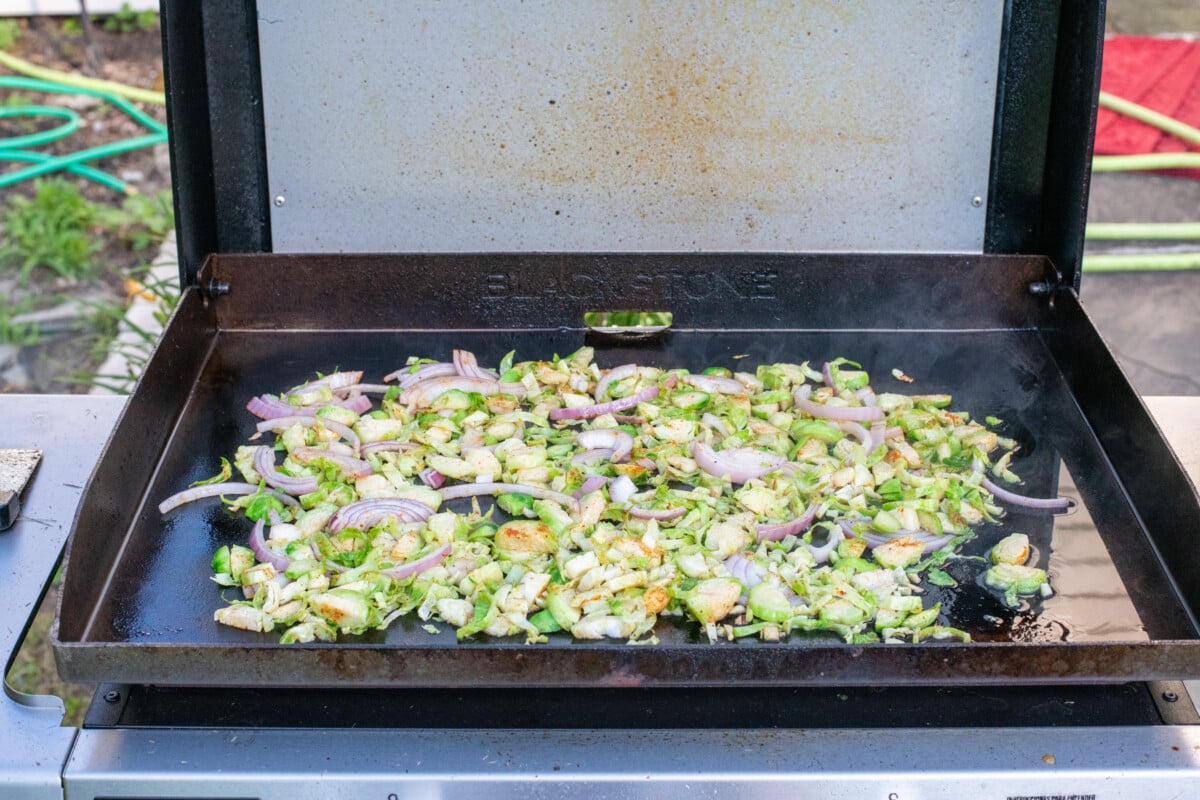 Vegetables cooking on Blackstone griddle