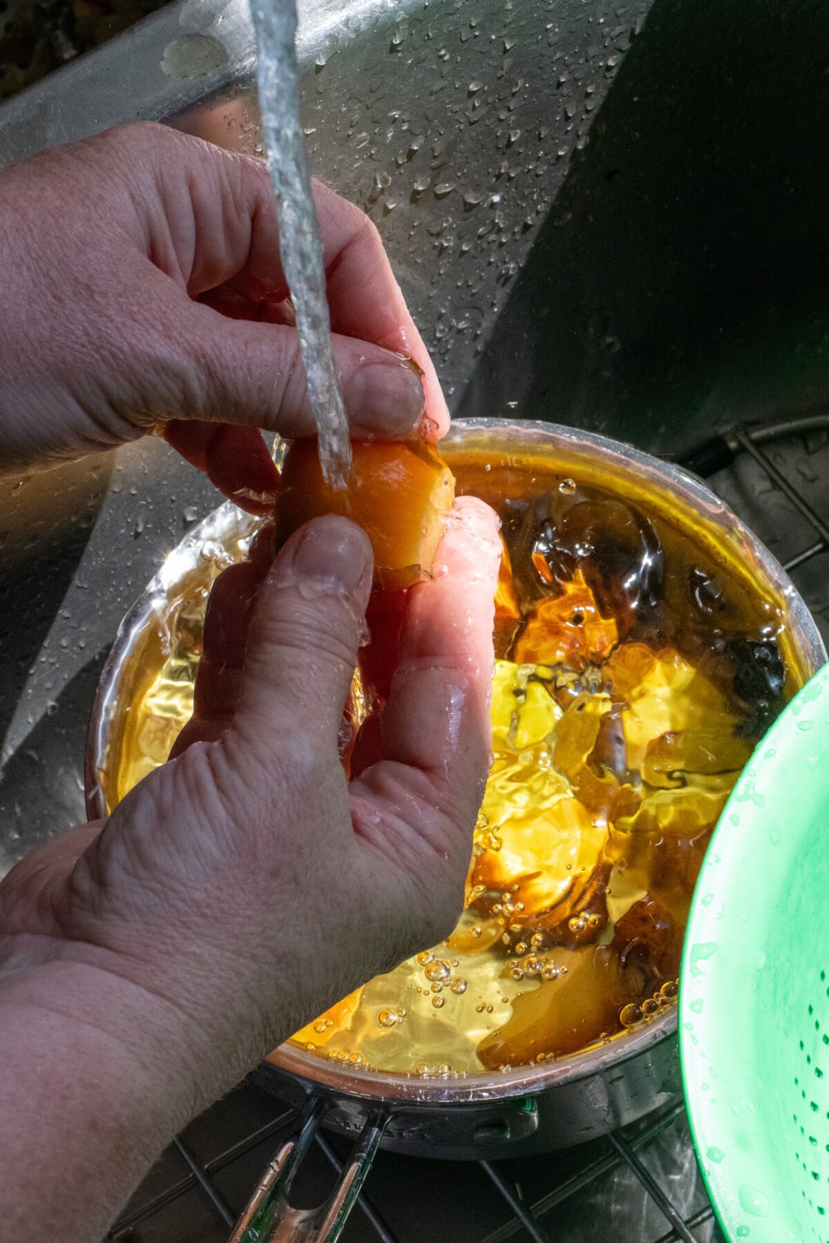 Woman's hands peeling boiled beets