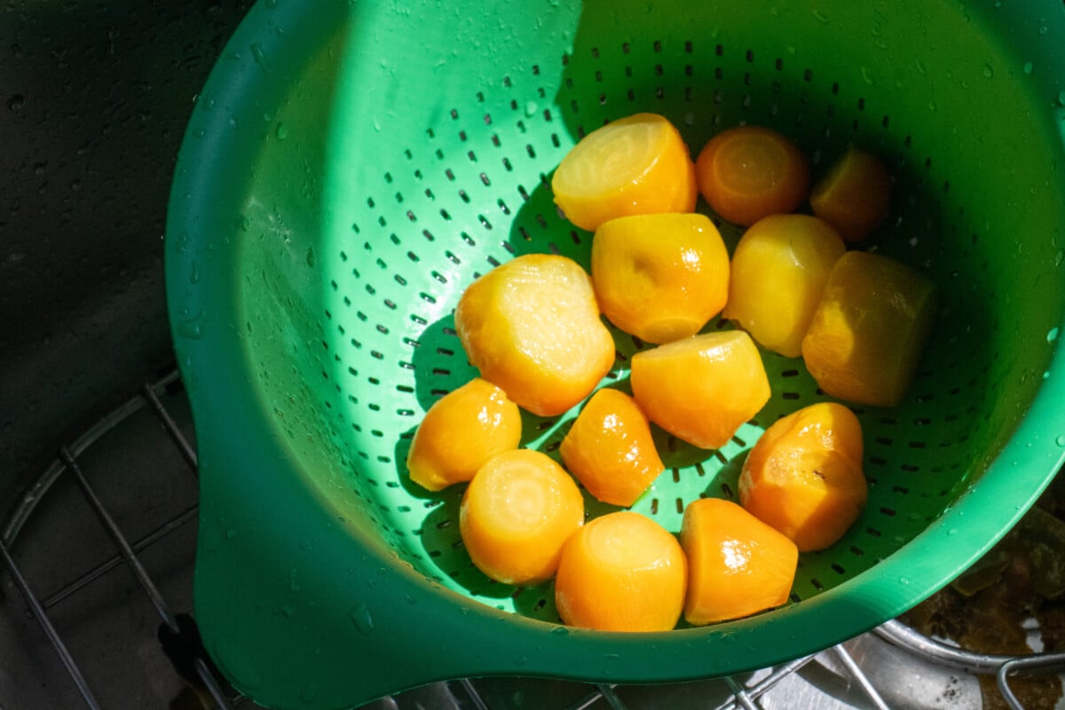 Colander with skinned golden beets
